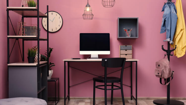 home office on pink wall