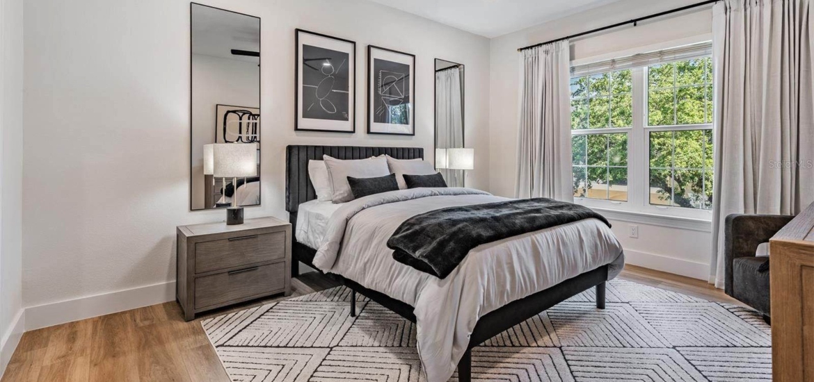 fully furnished primary bedroom in a rental house in tampa