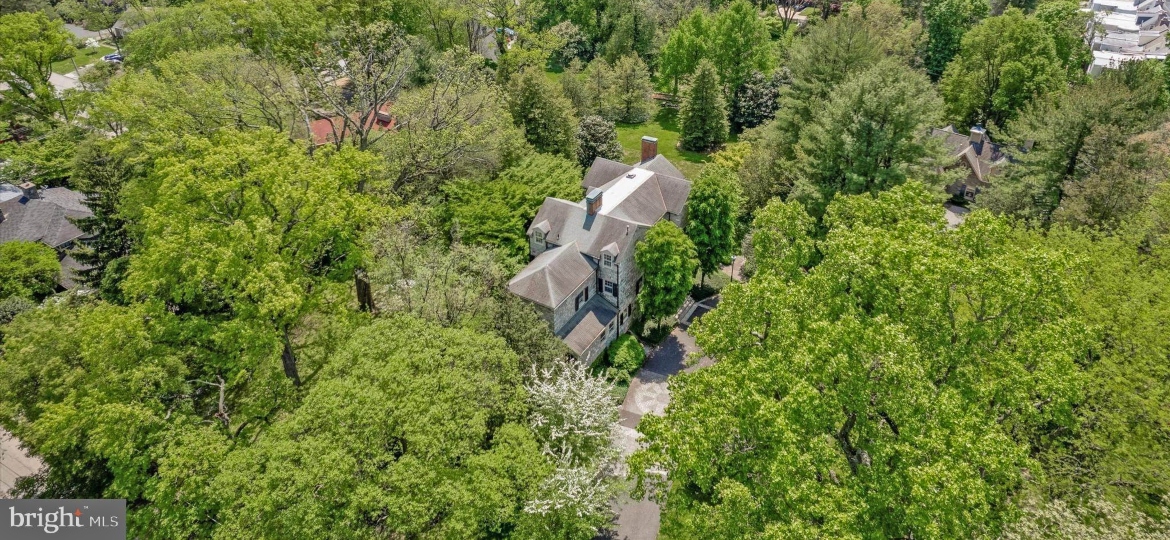 historical stone house for rent in philadelphia seen from above among trees